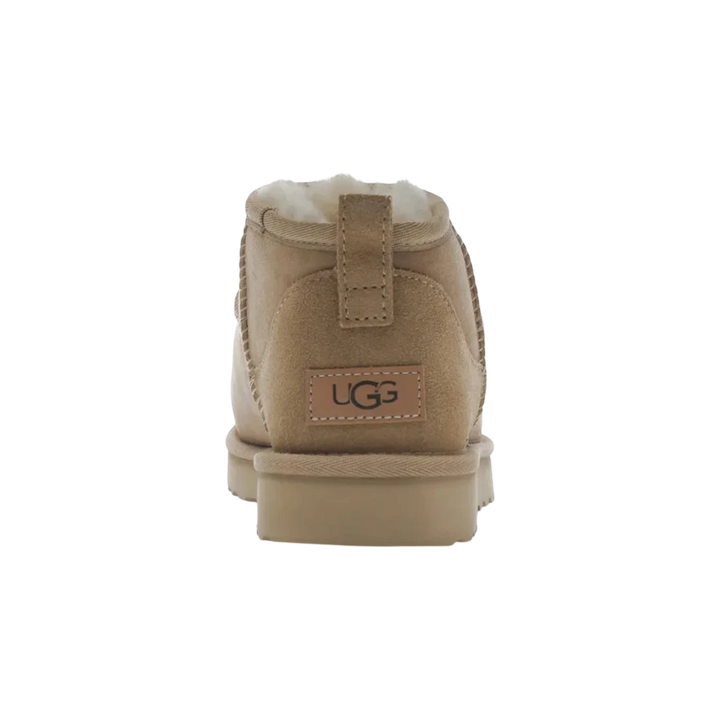 HypeSelection UGG Classic Ultra Mini Boot in Sand, featuring suede and sheepskin upper with UGGplush lining and SugarSole EVA outsole.