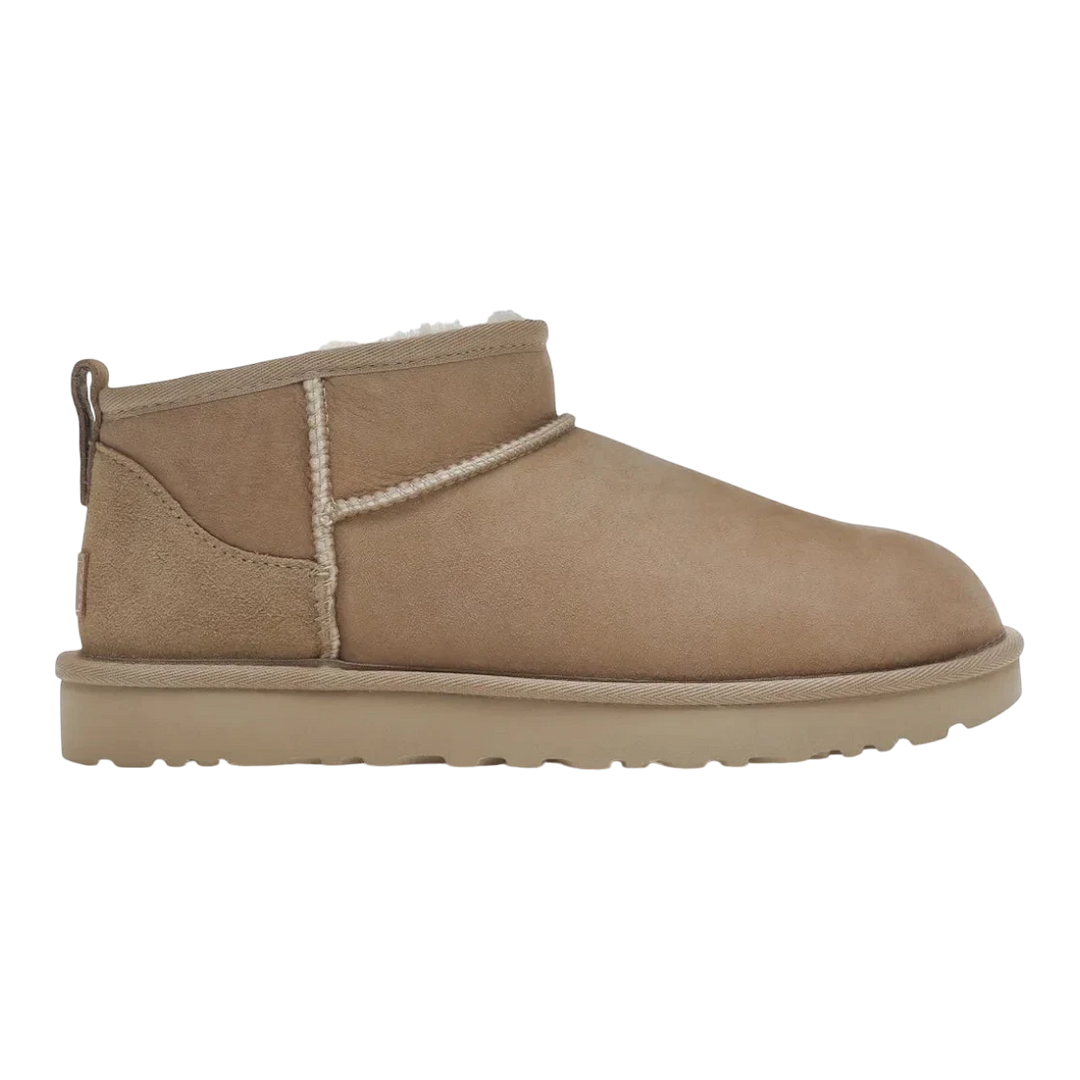 HypeSelection women's UGG Classic Ultra Mini boot in sand-colored sheepskin and suede with plush lining and EVA sole.