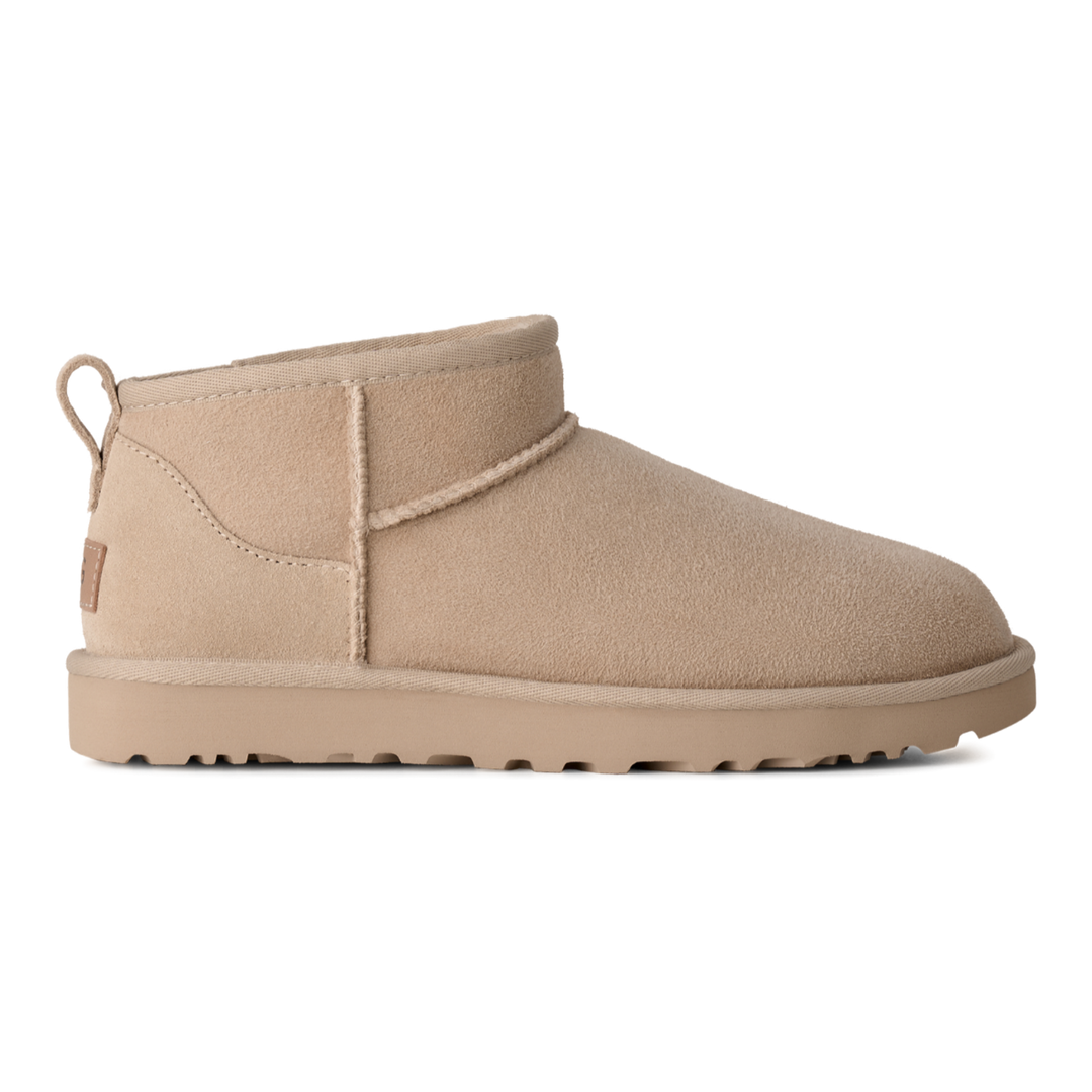 HypeSelection UGG Classic Ultra Mini boot in moonlight beige suede with an asymmetrical topline and pull tab.