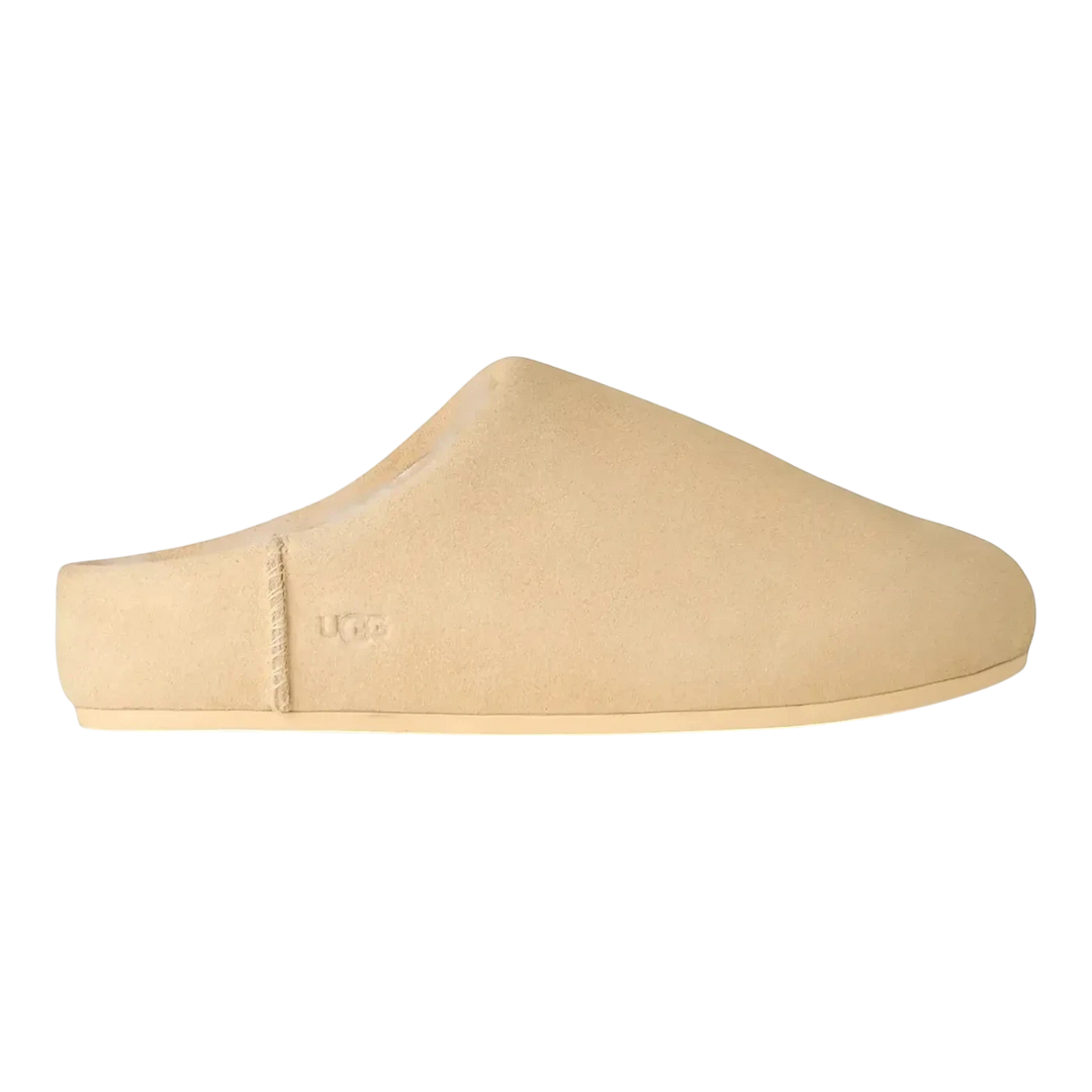 HypeSelection UGG Elea women's slip-on slipper in pale buttercup suede with sheepskin lining. Minimalist design for indoor/outdoor wear.