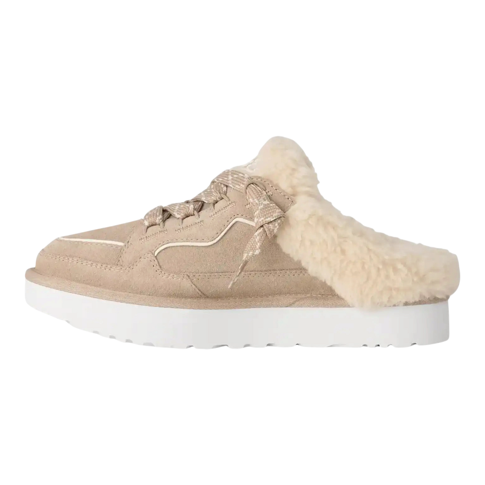 HypeSelection UGG Lowmel mule in Moonlight beige suede with curly wool lining, padded tongue, and white EVA outsole.
