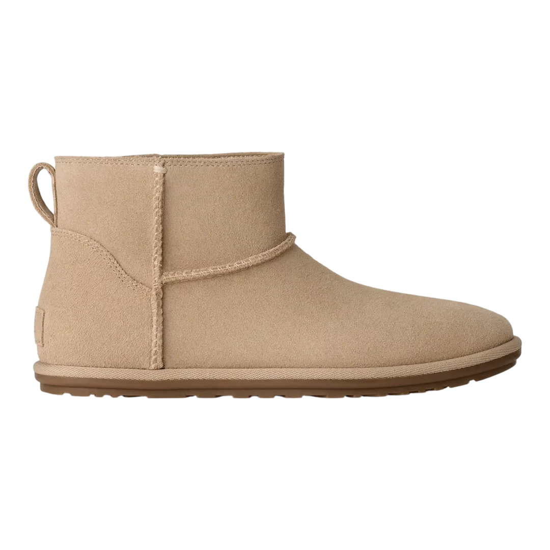 HypeSelection UGG Classic Mini Deconstructed boot in sand suede with a relaxed ankle-height profile and flat outsole.
