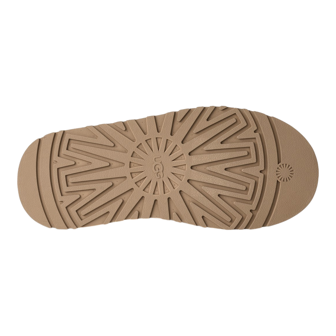HypeSelection UGG Tazz II slipper showing the textured sand-colored EVA platform outsole with signature tread pattern.