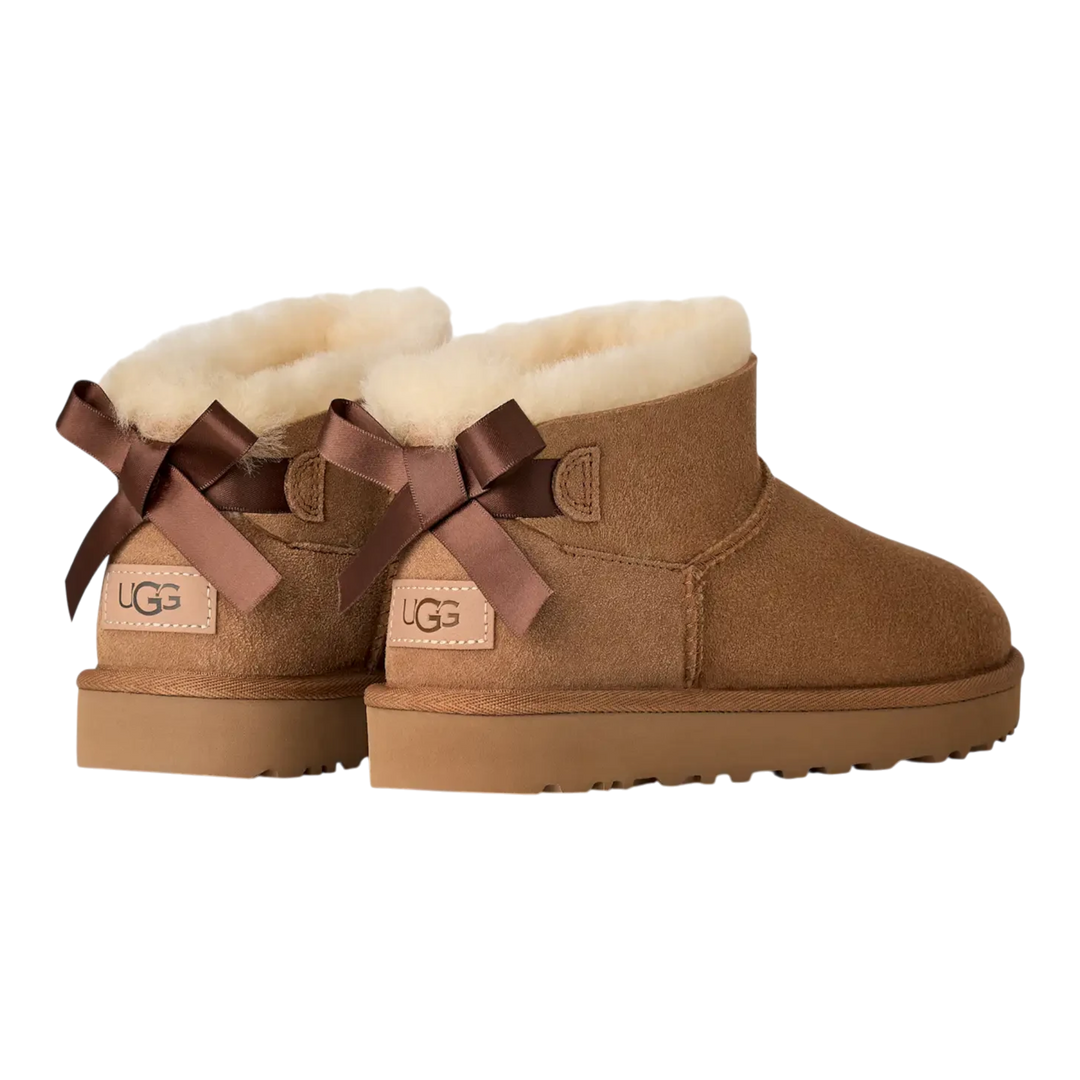 HypeSelection UGG Ultra Mini Bailey Bow boots in chestnut suede with back satin bows and plush wool lining.