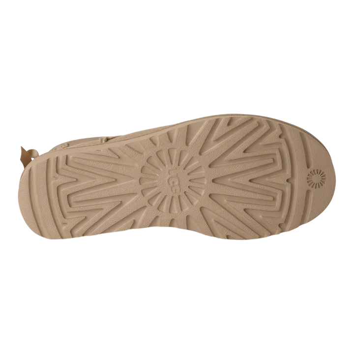 HypeSelection UGG Ultra Mini Bailey Bow boot in sand showing the textured rubber outsole pattern