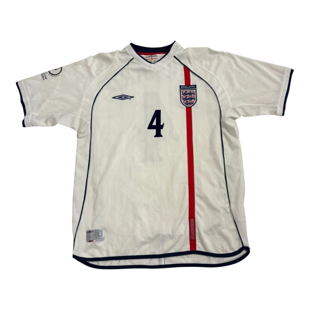 HypeSelection vintage white Umbro England soccer jersey with number 4, red stripe detail, and team crest.