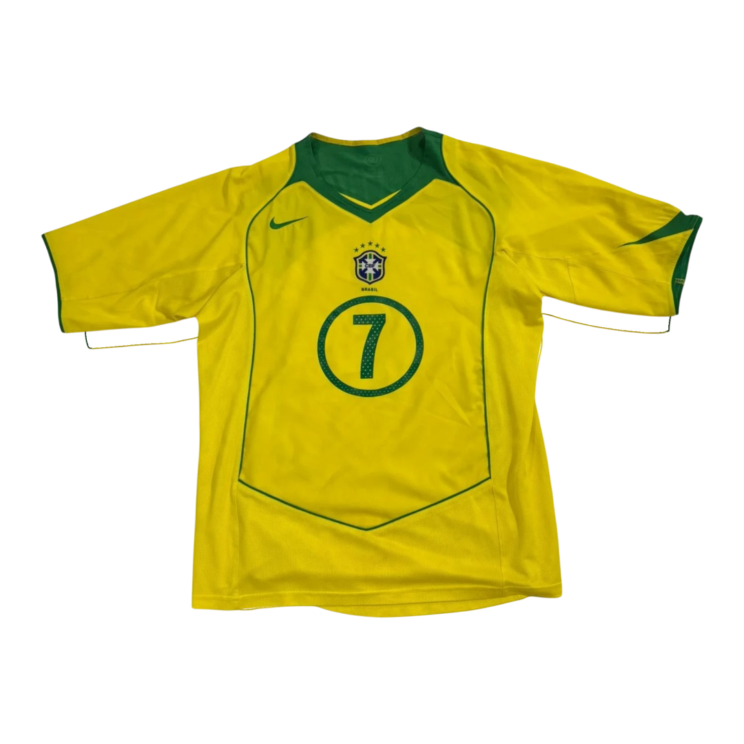 HypeSelection vintage Nike Brazil yellow soccer jersey with number 7 and green trim details.