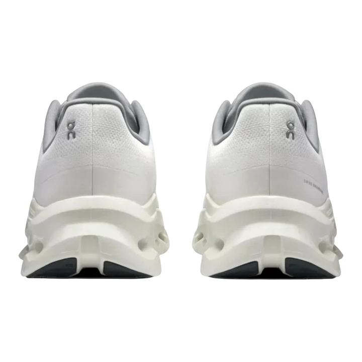 HypeSelection white running shoes with grey accents and unique sole design. Back view.