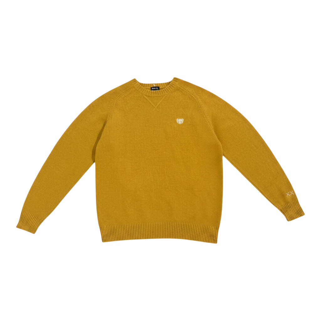 HypeSelection Uniqlo x KAWS yellow lambswool crew neck sweater with embroidered KAWS heart logo on chest and XX on sleeve.