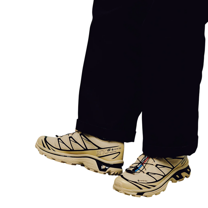 Salomon XT-6 GORE-TEX trail running sneakers in safari beige with black accents and Quicklace system.