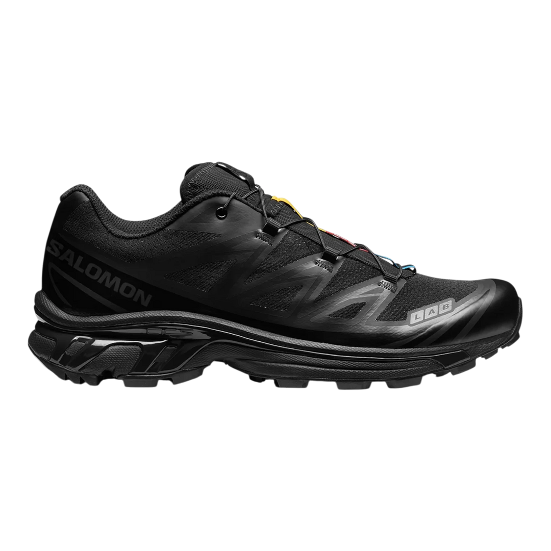 Salomon XT6 trail running shoes in black with Quicklace system and durable rubber outsole. Stealthy, tonal design.