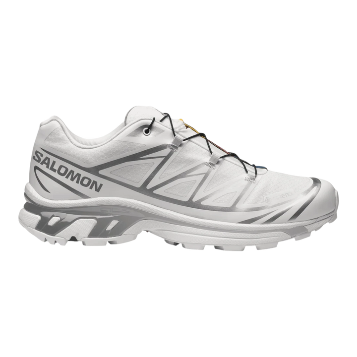 Salomon XT6 white and silver trail running shoes with Quicklace system and durable outsole.