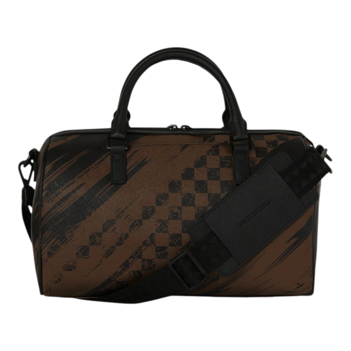 Sprayground mini duffle bag with brown smeared grunge pattern and black checkered accents. Features dual handles and a removable shoulder strap.